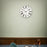 Arne Jacobsen Roman wall clock with minimalist design, round face, and sleek hands, perfect as a modern decorative accessory.