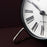 Roman table clock by Arne Jacobsen, featuring a sleek modern design and minimalist accessories style.