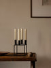Black Kubus candle holder by Audo Copenhagen, minimalist geometric accessory with a sleek modern design.