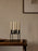 Black Kubus candle holder by Audo Copenhagen, minimalist geometric accessory with a sleek modern design.