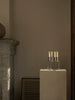 Audo Copenhagen Kubus zinc candle holder, minimalist geometric accessory with a square shape and matte finish.