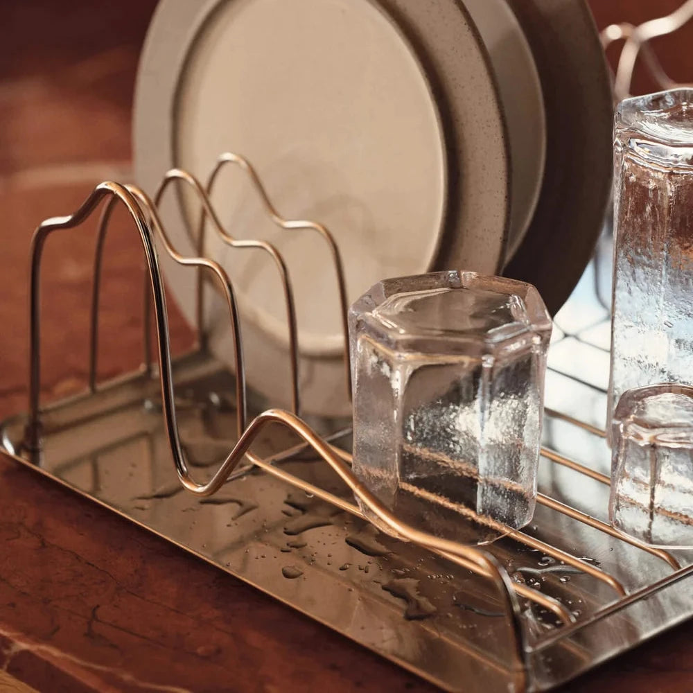 Ferm Living Curvature Dish Rack, stylish kitchen accessories with curved design, holding plates and utensils for drying.