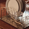 Ferm Living Curvature Dish Rack, modern black metal kitchen organizer with curved design and multiple slots for dishes and utensils.