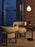 Tom Dixon Bell portable light in high-gloss burgundy finish, showcasing its sleek, modern design and compact size.