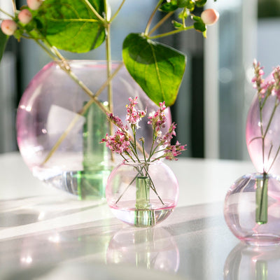 Mini pink bubble vase by Block Design, a stylish accessories piece with a rounded, translucent glass appearance.
