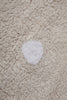 Beige washable rug with a biscuit pattern by Lorena Canals, showcasing its soft texture and stylish design for home decor.