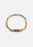Gold-plated Relier Nano bracelet by Skultuna, featuring a sleek, minimalist design with delicate chain and small charm.