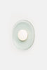 Crepe Sconce by Rich Brilliant Willing, modern lighting fixture with a textured crepe shade and sleek design, mounted on a wall.
