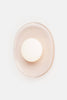 Crepe sconce by Rich Brilliant Willing mounted on a wall, featuring a textured fabric shade and modern lighting design.