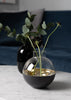 Skultuna Pomme accessories featuring a sleek, modern design with metallic finish, displayed on a neutral background.