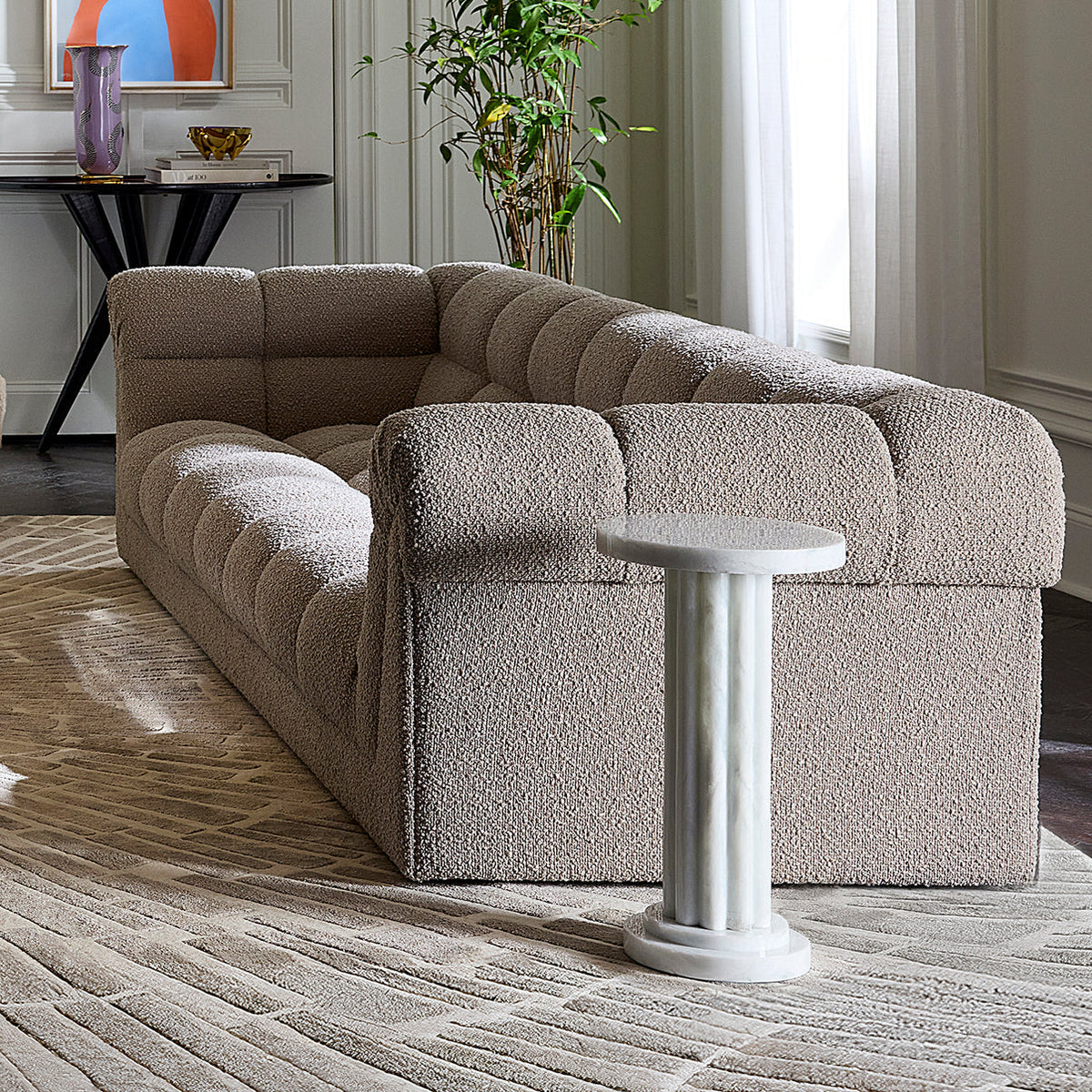 Jonathan Adler Como Neo Drinks Table in Soho city setting, showcasing modern design and sleek surface.