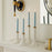 Set of two tall Geneva candle holders by Jonathan Adler, featuring sleek, modern accessories with a polished finish for elegant decor.