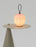 Red Filigrana Lantern table light by Established and Sons, featuring intricate design and warm illumination.