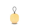 Yellow Filigrana Light table lantern by Established and Sons, with intricate cane design, glowing softly on a white background.