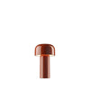 Red portable Bellhop table lamp by Flos with a sleek, modern design and illuminated light, perfect for versatile lighting.