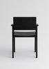 Vaarnii Maasto dining armchair with a wooden frame and upholstered seat, showcasing modern Scandinavian design.
