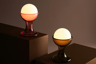 Modern Gelato lighting fixture by Established and Sons, showcasing sleek design and studio shot with a smooth, curved form.