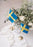 Modern Flagpole accessory by Skultuna featuring a sleek design, displayed on a flagpole with a blue sky background.