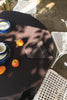 Set of four handloom napkins by Lorena Canals, showcasing natural fabric and intricate weaving in warm earthy tones.