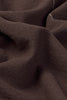Set of four handloom napkins by Lorena Canals, featuring intricate woven patterns on natural fabric.