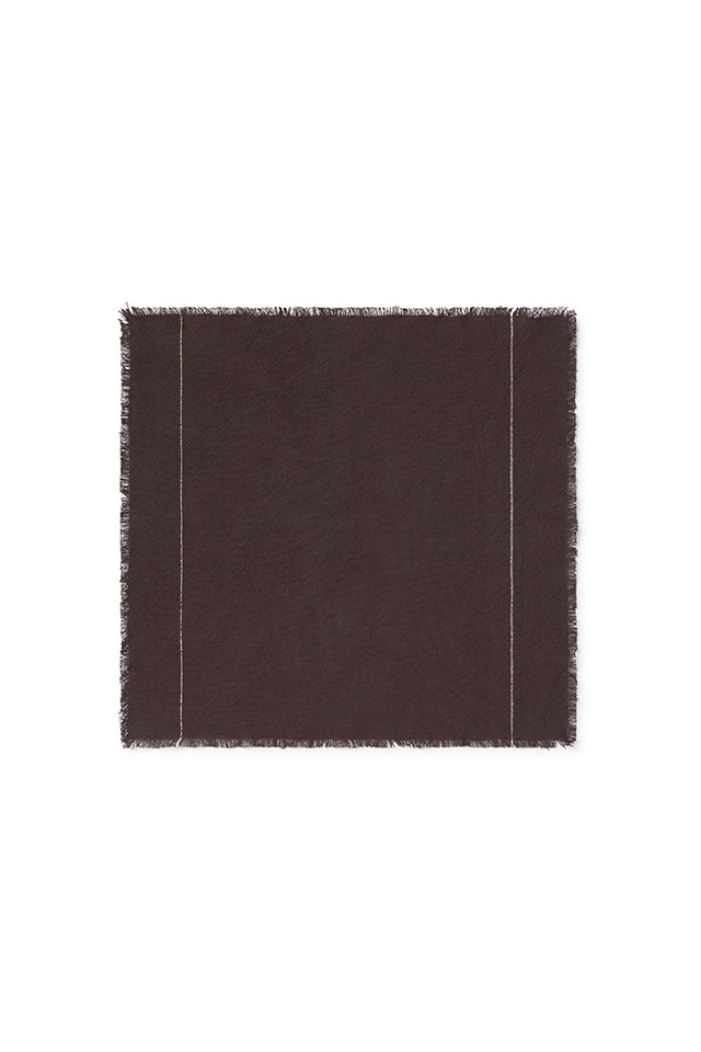 Set of four handloom napkins by Lorena Canals, showcasing woven fabric in earthy tones, perfect as elegant accessories.