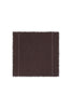 Set of four handloom napkins by Lorena Canals, showcasing woven fabric in earthy tones, perfect as elegant accessories.