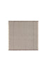 Set of four handloom napkins by Lorena Canals featuring intricate woven patterns in earthy tones.