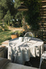 Handloom tablecloth by Lorena Canals featuring intricate woven patterns in neutral tones, perfect for elegant table decor.