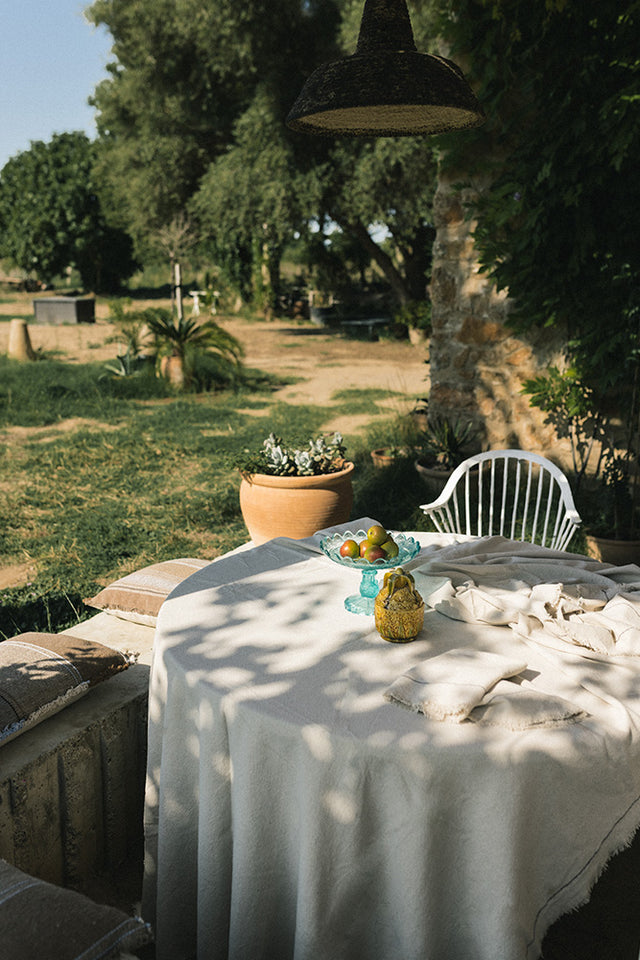 Handloom tablecloth by Lorena Canals featuring natural woven fabric, perfect for adding a stylish touch to your table setting.