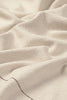 Handloom tablecloth by Lorena Canals showing a natural woven fabric with intricate patterns, perfect as a stylish home accessory.