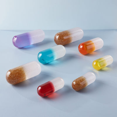 Medium acrylic pill accessory by Jonathan Adler, featuring a smooth, glossy surface in a modern, minimalist design.