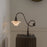 Modern Shop PH 1/1 piano table lamp with sleek design and adjustable arm, ideal for desk or bedside lighting.