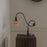 Modern Shop PH 1/1 piano table lamp featuring a sleek design with a black finish and adjustable shade for reading or decor.