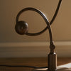 Modern Shop PH 1/1 piano table lamp with sleek design and adjustable arm, ideal for reading or decorative lighting in any space.
