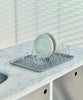 Hay Shortwave Dish Rack accessory with a sleek design, featuring multiple slots for drying dishes on a modern kitchen countertop.