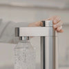 Stelton Brus Carbonator accessory for soda making, featuring sleek stainless steel design and compact form.