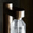 Stelton Brus Carbonator accessory with sleek design, used for carbonating beverages, in a modern minimalist style.