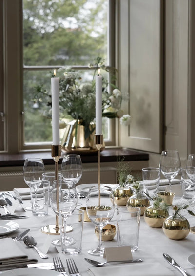 Skultuna Nattlight candlestick accessory with a sleek, modern design, showing a metallic finish and elegant form.
