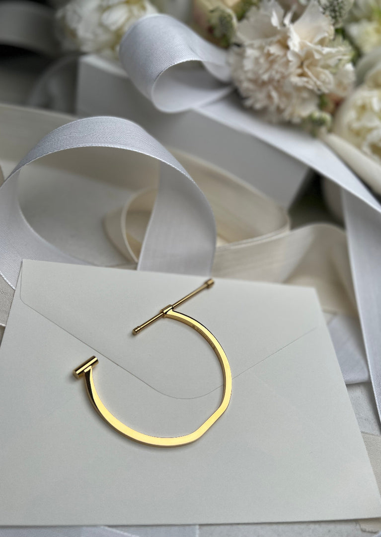 Gold plated Omega bangle by Skultuna, stylish jewelry accessory with a sleek, polished finish and modern design.