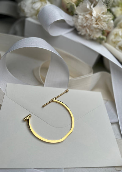 Gold plated Omega bangle by Skultuna, stylish jewelry accessory with a sleek, polished finish and modern design.