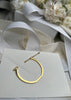 Gold plated Omega bangle by Skultuna, stylish jewelry accessory with a sleek, polished finish and modern design.