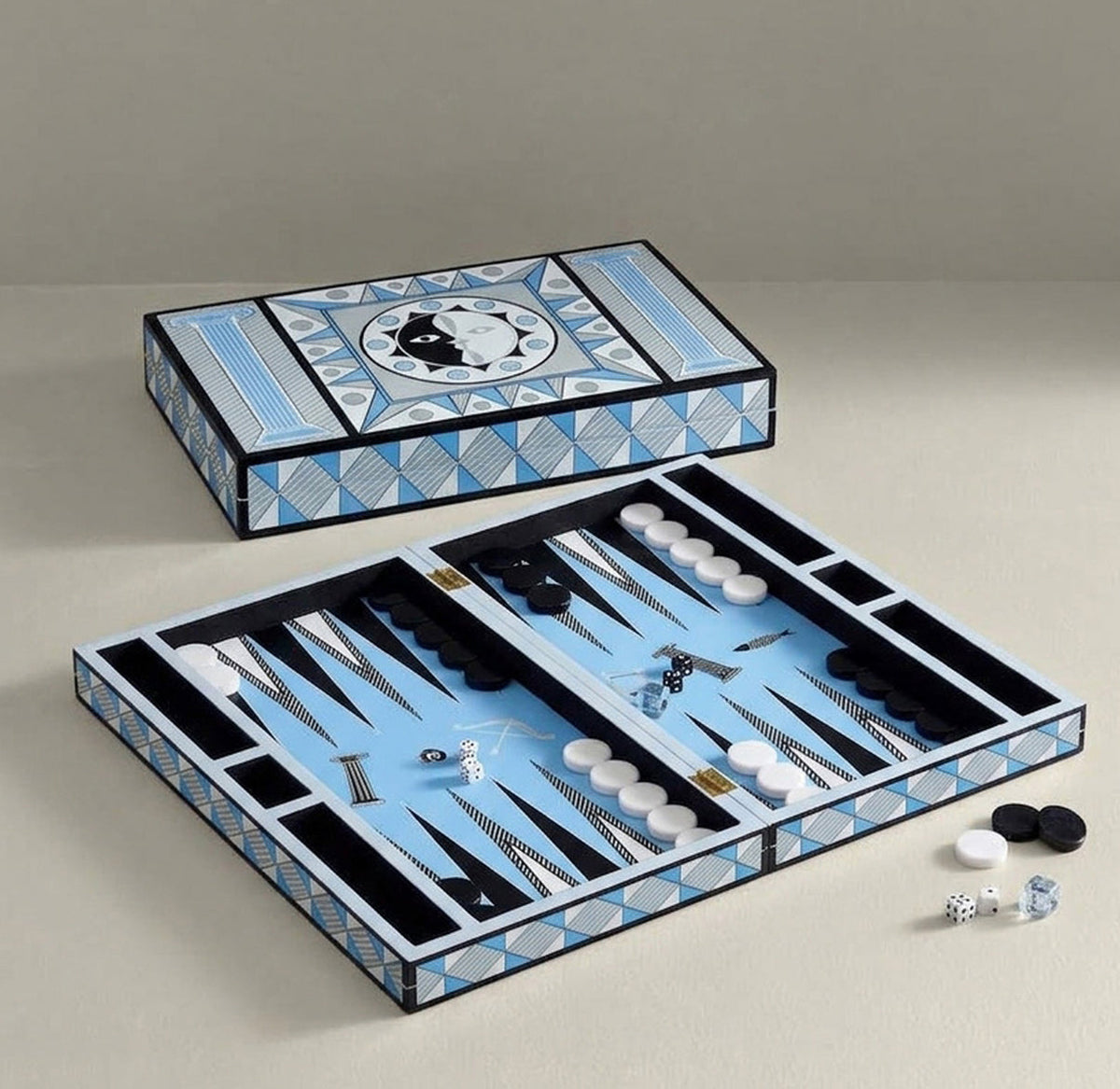 Jonathan Adler Soleil backgammon set with stylish accessories, featuring colorful game pieces and a modern, decorative board.