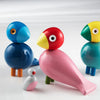 Colorful wooden Bird toys from Kay Bojesen's Songbird Collection, designed for kids, featuring bright, playful animal figures.