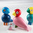 Colorful wooden Bird toys from Kay Bojesen's Songbird Collection, designed for kids, featuring bright, playful animal figures.