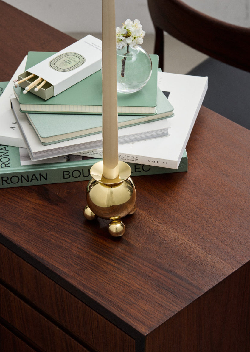 Elegant Skultuna ball candlestick accessory with a polished metallic finish, designed to hold a candle securely.