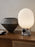Audo Copenhagen JWDA table lamp with a sleek Calacatta Viola marble base and a simple, elegant lighting shade.