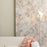 Perch Floor Light by Moooi, a stylish lighting fixture with a modern design, featuring a soft pink and rust color scheme.