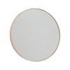 OYOY Mun wall mirror with natural wood frame, modern accessories piece, mounted on a wall in a stylish interior setting.