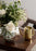 Skultuna Nurture Watering Can in sleek metal with a curved handle, designed for garden or indoor plant watering accessories.