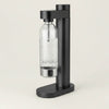 Stelton Brus Carbonator accessory in black metallic finish, designed for carbonating beverages with a sleek, modern look.